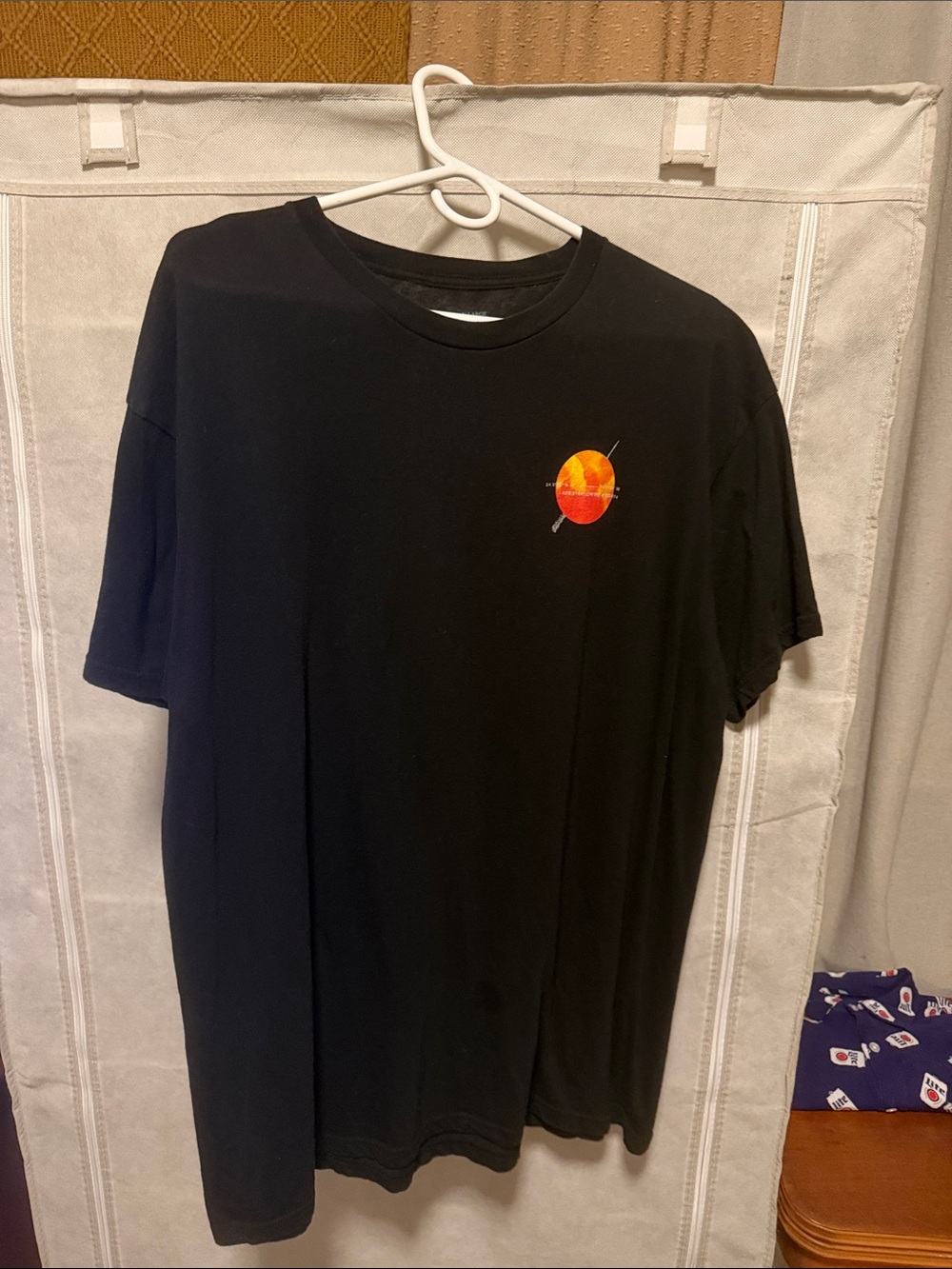 Men's Black Graphic Tee with Orange Planet Motif